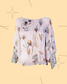 Blusa traslúcida con estampado floral, manga larga con aplicaciones